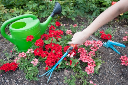 Gardeners Downe working safely with protective equipment